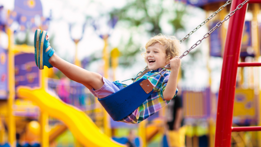 Child swinging at the park