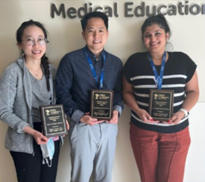 Valley Children's pediatric residents posing with their research award plaques