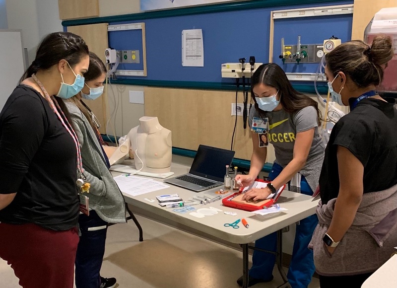 Photo of a task trainer in progress