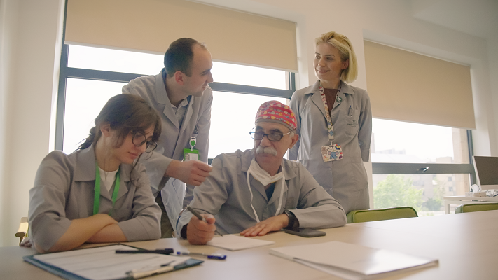 Four physicians from Wigmore Women's & Children's Hospital in Yerevan, Armenia, meet at a table