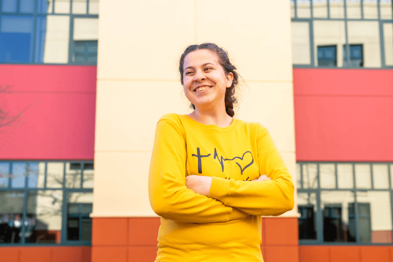 Gabby smiles in front of Valley Children's Hospital