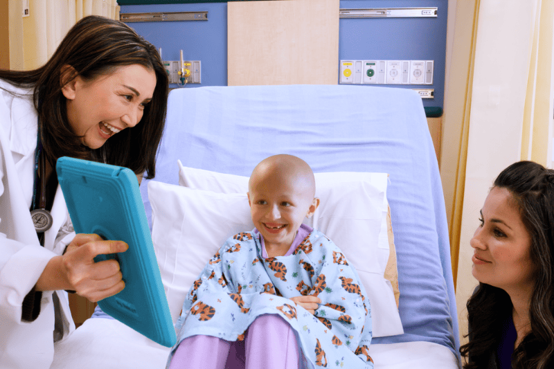 Dr. Ti with a patient and parent