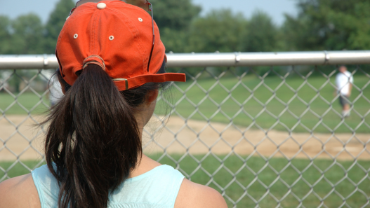 Baseball fan watching game at baseball field