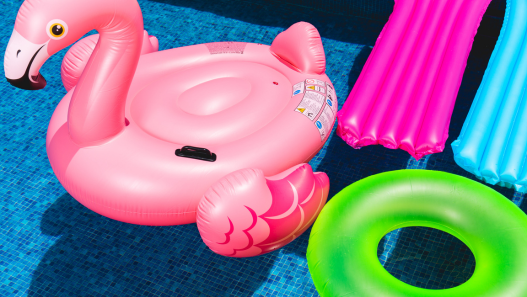 Colorful Pool Floaties in Water