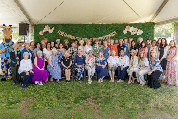 Members of the Holiday Guild smile for a group photo