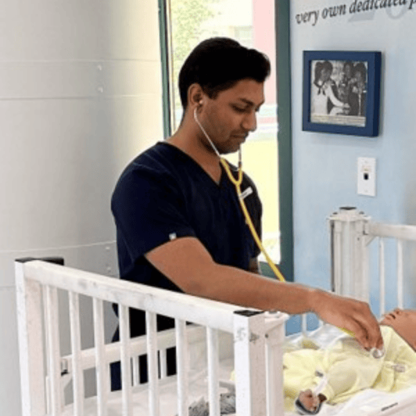 A pediatric resident practices in a simulation