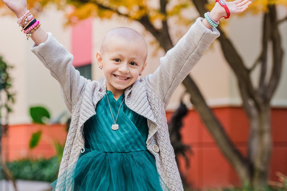 Radiothon: Abigail, a little girl in a green dress smiles