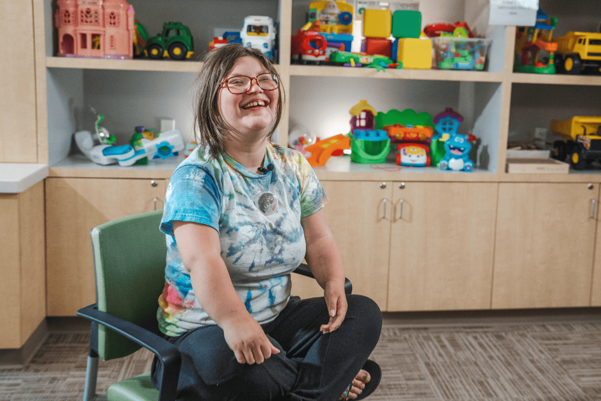 A teenage girl smiles