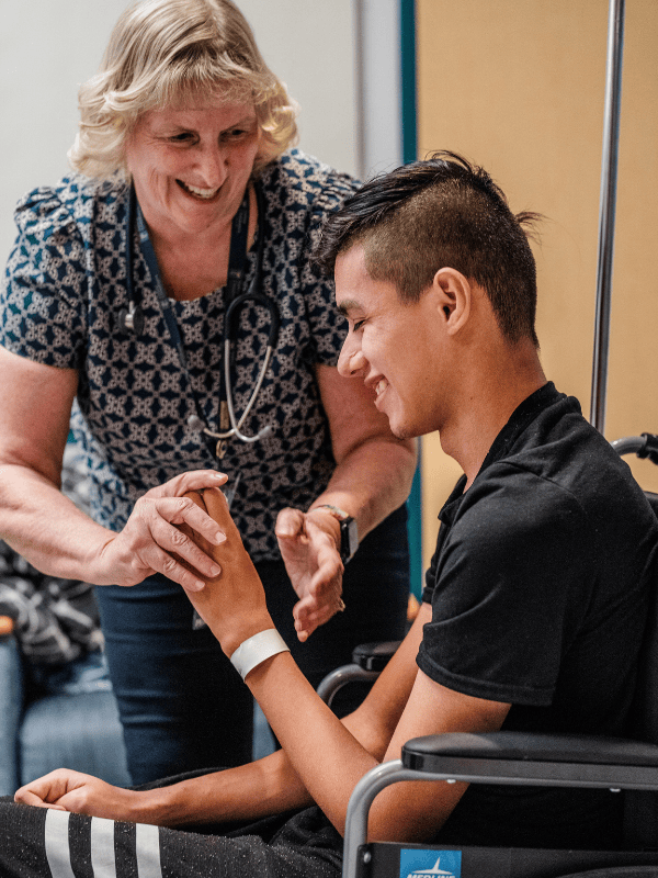 Sharon Vanderplaats, NP, works with a patient