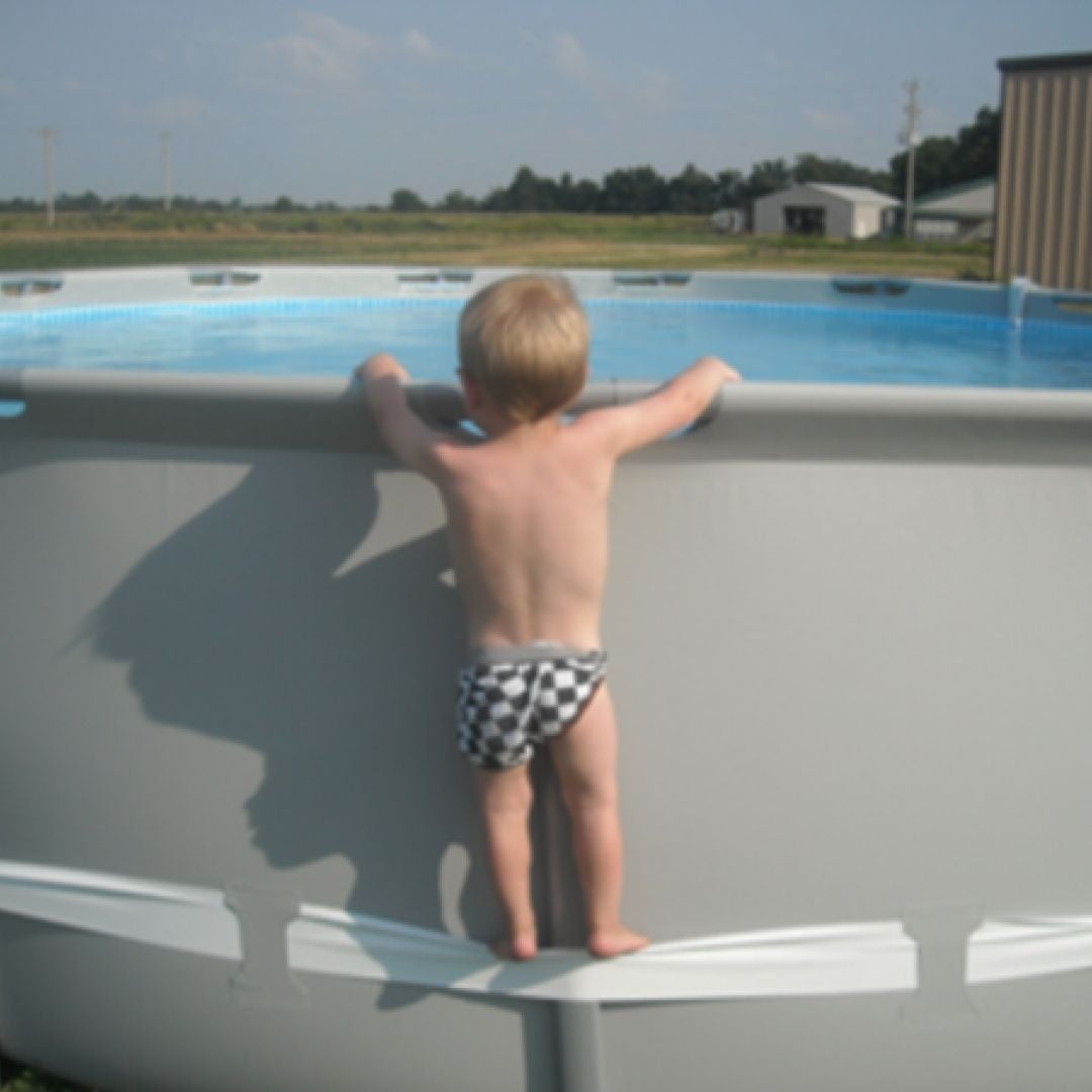 Boy Standing on Pool 